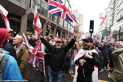 Far-right protesters walk through London on Saturday in a rally endorsed by Robinson