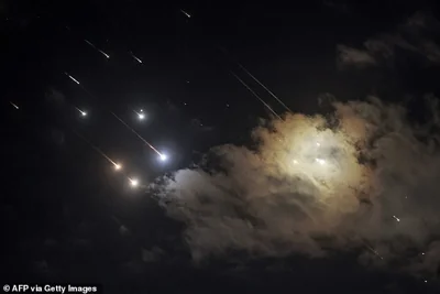 Projectiles are pictured being intercepted by Israel above Jerusalem on Tuesday night