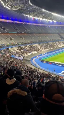 Mobile phone footage shows fans in the Stade de France fleeing their seats after a fight was reported to have taken place between the two set of fans