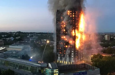 Devastating flames and thick smoke encompassing the high-rise Grenfell Tower in London.