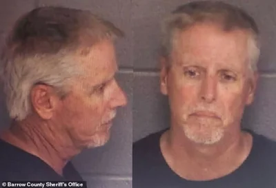 The first mugshot has emerged of Colin Gray, the man accused of buying his 14-year-old son Colt the AR-15-style rifle the boy used to shoot dead four people at his high school