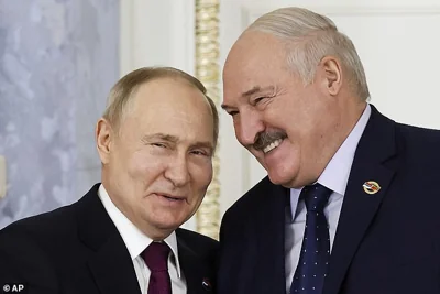 Russian President Vladimir Putin and Belarus President Alexander Lukashenko shake hands during a meeting in Russia in January