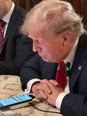 Trump appeared to enjoy the chat (pictured) where he laid into Kamala and Mr Musk joined in