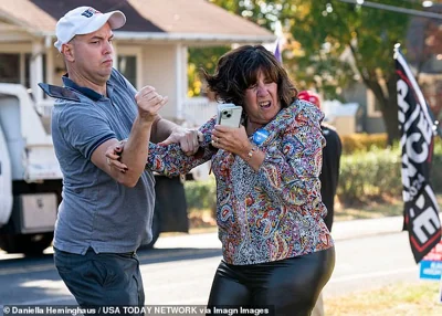 A Trump supporter, left, gets into a confrontation with a Harris fan outside an event for Tim Walz in Bristol Township, Pennsylvania, last week.