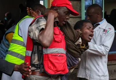 GRIEF NOT BRIEF A relative of a student who perished in a fire is overcome with emotion after visiting the Hillside Endarasha Academy in Kieni, Nyeri County, central Kenya, on Sept. 6, 2024. EPA PHOTO