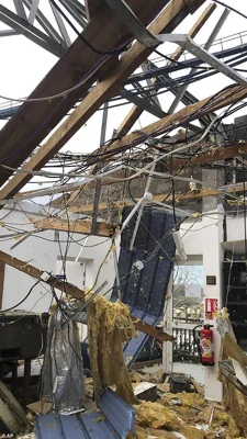 This photo provided Sunday Dec.15, 2024 by the French Army shows a damaged house in the French territory of Mayotte in the Indian Ocean