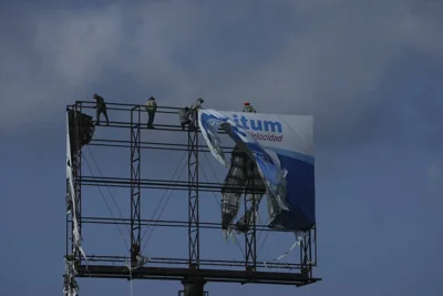 Workers remove an advertisement from a billboard for protection ahead of Hurricane Beryl's expected arrival, in Playa del Carmen, Mexico, Wednesday, July 3, 2024. AP PHOTO