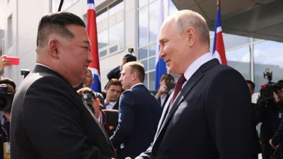 Russian President Vladimir Putin, right, and North Korea's leader Kim Jong Un shake hands, about 200 kilometers (125 miles) from the city of Blagoveshchensk Sept. 13, 2023. 