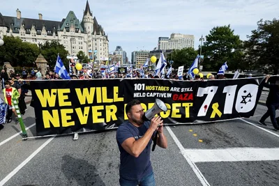 Pro-Israel protesters chant as they march towards Parliament Hill from City Hall during a ceremony in Ottawa, October 6, 2024