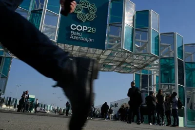 A glass and metal structure marks an entry point to venue in Baku Azerbaijan where COP29, the U.N. climate talks, begin on Monday. 