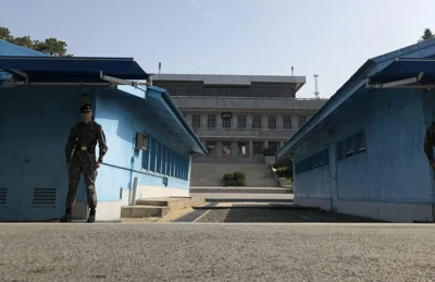 Blue shacks straddle the line between the two Koreas at the Joint Security Area. Courtesy of NK News