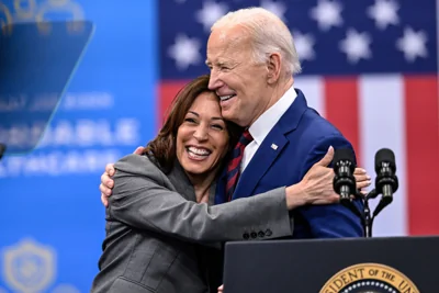 Vice President Kamala Harris embraces President Joe Biden after a speech on healthcare in Raleigh, N.C., March. 26, 2024.