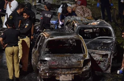 ANTI-CHINESE ASSAULT Security officials inspect the site of a deadly explosion outside the international airport in the city of Karachi, southern Pakistan, on Oct. 7, 2024. EPA PHOTO