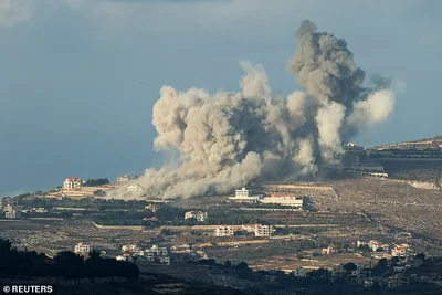 Smoke billows after an Israeli Air Force air strike on a village in southern Lebanon, amid cross-border hostilities between Hezbollah and Israel, as seen from northern Israel October 1, 2024