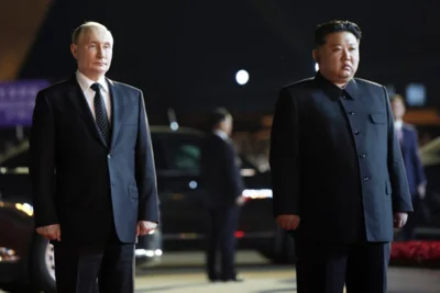 Russian President Vladimir Putin, left, and North Korea's leader Kim Jong Un stand together during the departure ceremony at an international airport outside Pyongyang, North Korea, on Wednesday, June 19, 2024. (Gavriil Grigorov, Sputnik, Kremlin Pool Photo via AP)