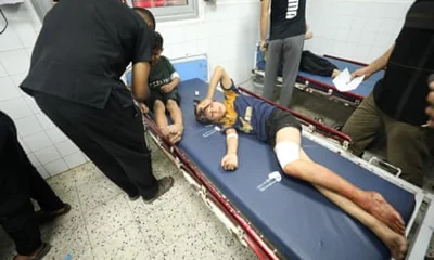 Injured Palestinian children await medical treatment at the Baptist hospital after an Israeli attack on Jabalia refugee camp in Gaza on 9 October