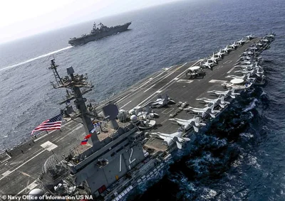 The US has urged the USS Abraham Lincoln (pictured, file) to hurry its approach to the region