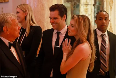 Former U.S. Rep. Matt Gaetz (C) and wife Ginger Luckey Gaetz talk with another guest at the America First Policy Institute Gala held at Mar-a-Lago on November 14, 2024 in Palm Beach.