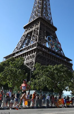 He was spotted just above the Olympic rings adorning the second section of the monument, just above the first viewing deck