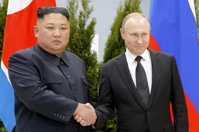 Vladimir Putin and Kim Jong Un 