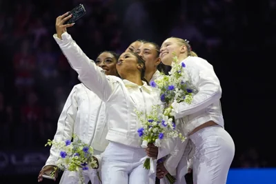 Jordan Chiles takes a selfie with the team after the women were named to the 2024 Olympic team at the United States Gymnastics Olympic Trials on Sunday, June 30, 2024, in Minneapolis. AP PHOTO
