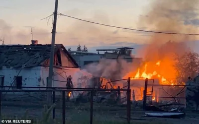 A building on fire in the town of Sudzha following an incursion into the Kursk region on 7/8