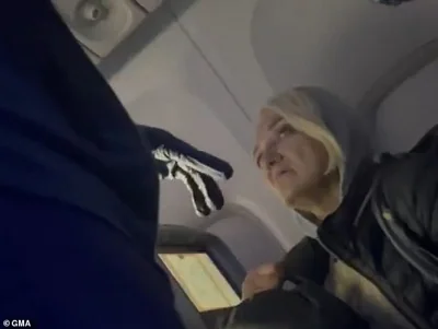 The woman who allegedly snuck onto a Delta Airlines flight from New York to France last week, named as Svetlana Dali, was seen in bombshell new footage begging flight attendants not to 'send her back to America'