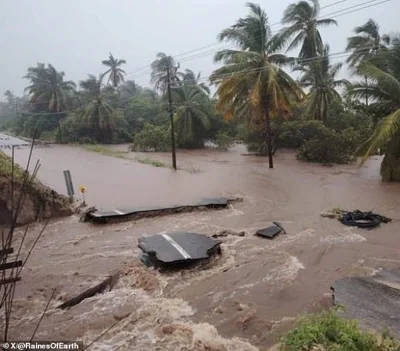 Parts of a road are overrun with deluge