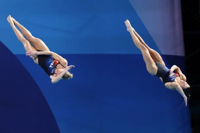 United States' Sarah Bacon and Kassidy Cook compete in the Women's Synchronised 3m Springboard Final at the Paris 2024 Olympic Games Paris 2024 at Aquatics Centre on July 27, 2024 in Paris, France.