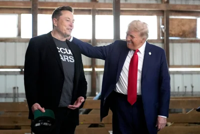 Elon Musk, left, and Trump attend a campaign event at the Butler Farm Show on Oct. 5, 2024, in Butler, Pennsylvania. Musk, recently tapped to lead the Department of Government Efficiency, met with Iran’s ambassador to the UN on Monday