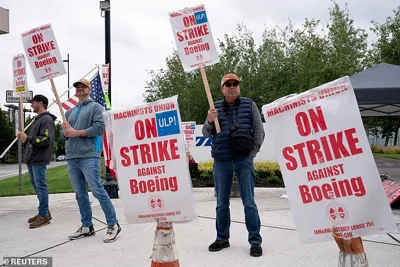 Boeing factory workers and supporters gather on a picket line during the strike near the entrance to a Boeing production facility in Renton, Washington