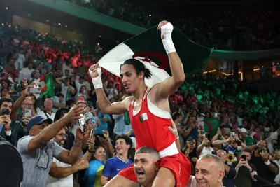 Imane Khelif celebrates her Olympic gold medal with Algeria fans in Paris