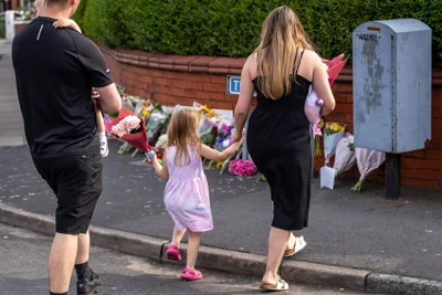Families leaving tributes at the scene in Southport