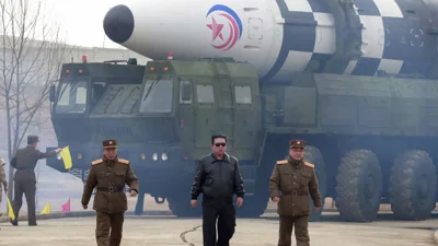 FILE - In this photo released by North Korea its president Kim Jong Un, centre, walks around what it says is a Hwasong-17 missile at an undisclosed location, March 24th 2022