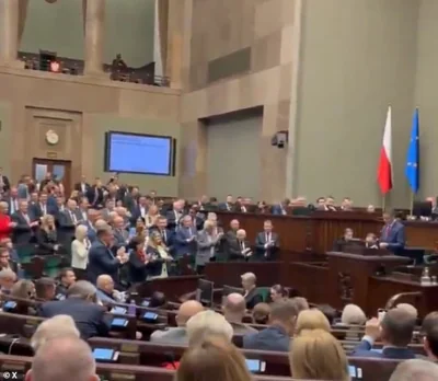 Members of the Sejm stood to applaud as chants of 'Donald Trump' rang out