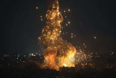 Explosions erupt as Israeli forces shell buildings in Beirut, on Oct. 6, 2024.