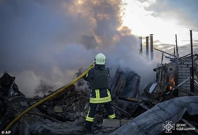 In this photo provided by the Ukrainian Emergency Service, firefighters put out the fire following a Russian rocket attack in Odesa region Ukraine, Sunday, November 17, 2024