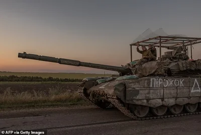 Ukrainian servicemen operate a tank on a road near the border with Russia, in the Sumy region of Ukraine, on August 14, 2024