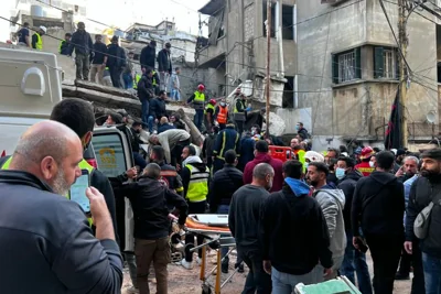 Lebanese first responders arrive at the site of an Israeli airstrike that targeted a building in the capital city of Beirut on Nov. 26, 2024.