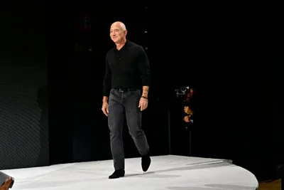 Mr. Bezos walking onto a stage.