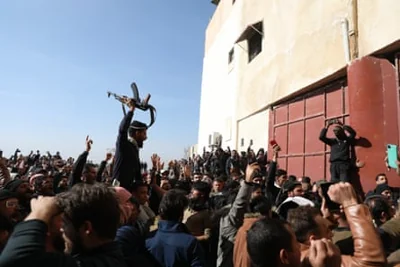 Syrians gather at Sednaya prison in Damascus