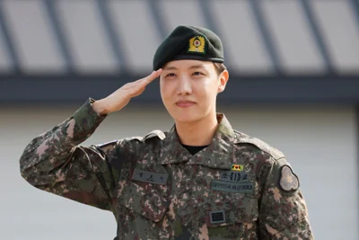 K-pop boy band BTS member J-Hope salutes after being discharged from his mandatory military service outside a military base in Wonju