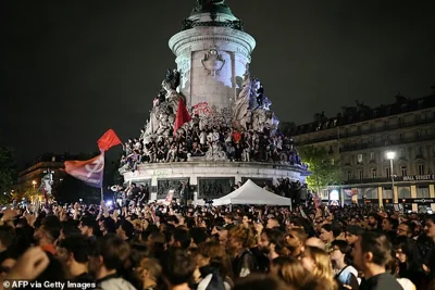 Demonstrators take part in a rally against far-right after the announcement of the results of the first round of parliamentary elections, at Place de la Republique in Paris on June 30, 2024