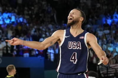 United States' Stephen Curry (4) celebrates after beating France to win the gold medal during a men's gold medal basketball game at Bercy Arena at the 2024 Summer Olympics, Saturday, Aug. 10, 2024, in Paris, France. AP PHOTO