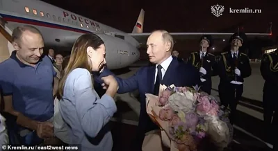 Anna Dultseva broke down in tears before Putin as Artem shepherded the kids onto the runway