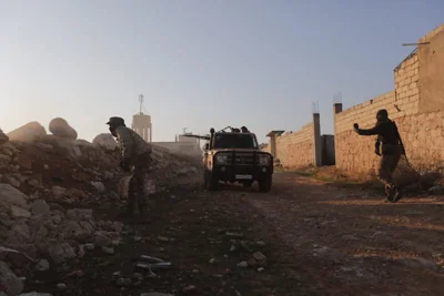 Rebel fighters fire towards Syrian army troops in the Rashidin district on the outskirts of Aleppo. Photograph: Bakr Alkasem/Getty Images