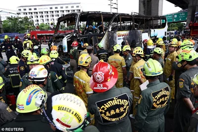 Firefighters gather around a burnt-out bus that was carrying teachers and students from Wat Khao Phraya school, reportedly leading to some on board being hospitalised, on the outskirts of Bangkok, Thailand, October 1, 2024