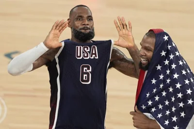 United States' LeBron James (6) and United States' Kevin Durant (7) react after winning a men's gold medal basketball game against France at Bercy Arena at the 2024 Summer Olympics, Saturday, Aug. 10, 2024, in Paris, France. AP PHOTO