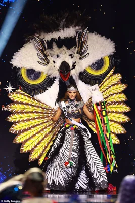 Miss Bolivia, Juliana Barrientos, adorned a stunning skirt and headdress in the shape of an owl