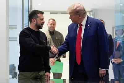 Trump and Ukraine’s President Volodymyr Zelenskyy shake hands during their meeting in September this year